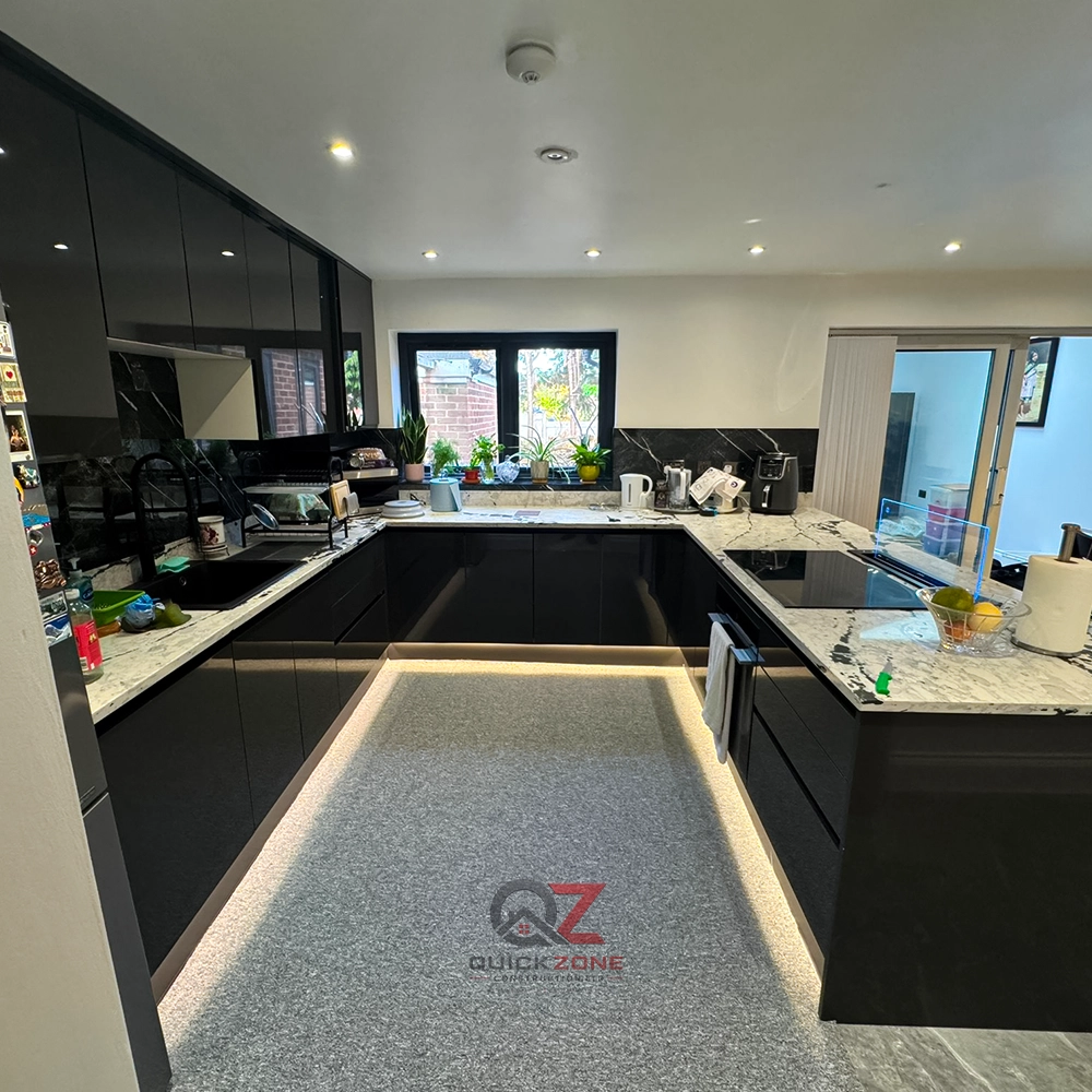 modern black kitchen renovation with large central island